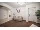 Cozy living room featuring a couch, staircase, and stylish decor at 7538 Mustang St, Las Vegas, NV 89131