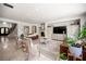 Bright living room area with stone floors, fireplace, elegant decor, and staircase at 7538 Mustang St, Las Vegas, NV 89131