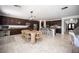 Spacious kitchen and living area with modern lighting and an island featuring bar stool seating at 7538 Mustang St, Las Vegas, NV 89131