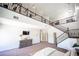 View from the top of the stairs looking at the main bedroom and loft area at 7538 Mustang St, Las Vegas, NV 89131