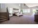 Spacious main bedroom features high ceilings, many windows, and a staircase at 7538 Mustang St, Las Vegas, NV 89131