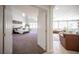 View into the main bedroom suite, showcasing the carpet, large windows, and ample space at 7538 Mustang St, Las Vegas, NV 89131