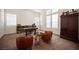 Bright office space featuring a desk, chairs, and ample storage at 7538 Mustang St, Las Vegas, NV 89131