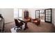 Well-lit office with a wooden desk, leather chairs, and a view to a courtyard at 7538 Mustang St, Las Vegas, NV 89131