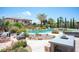 Backyard pool area with mature landscaping, patio, pool and lounge chairs perfect for relaxing by the pool at 7538 Mustang St, Las Vegas, NV 89131