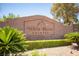 Community entrance sign for White Horse Estates with desert landscaping, palm trees, and stone walls at 7538 Mustang St, Las Vegas, NV 89131