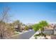 Street view with desert landscaping and mountain views located in a quiet neighborhood at 7538 Mustang St, Las Vegas, NV 89131