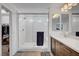 Contemporary bathroom showcasing walk-in shower, dual sinks, and neutral finishes at 7756 Seville Estates Ct, Las Vegas, NV 89113