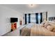 Well-lit primary bedroom offering plush carpet, ample space, en-suite bath and beautiful natural light at 7756 Seville Estates Ct, Las Vegas, NV 89113
