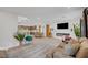 Bright open-concept living space with a fireplace and stylish decor, perfect for entertaining at 7756 Seville Estates Ct, Las Vegas, NV 89113