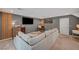 Comfortable living room with a gray color scheme, modern furniture, and large television, perfect for relaxing at 7756 Seville Estates Ct, Las Vegas, NV 89113
