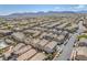 Expansive aerial of a residential area with mountain views in the distance at 7852 Running Doe Ct, Las Vegas, NV 89149