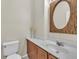 Bathroom with a rustic-framed mirror and modern fixtures at 7852 Running Doe Ct, Las Vegas, NV 89149