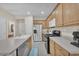 Modern kitchen with stainless steel appliances, spacious countertops, and ample cabinetry at 7852 Running Doe Ct, Las Vegas, NV 89149