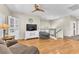 Inviting living room with wood floors, large windows, and neutral decor at 7852 Running Doe Ct, Las Vegas, NV 89149