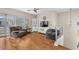 Comfortable living space featuring wood floors, plush seating, and natural light at 7852 Running Doe Ct, Las Vegas, NV 89149