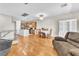 Open-concept space with living room and dining area featuring wood floors at 7852 Running Doe Ct, Las Vegas, NV 89149