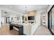 Comfortable living area includes an entertainment center, plush seating, and seamless access to the kitchen at 796 Windover Ct, Las Vegas, NV 89138