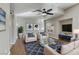 Comfortable living room with a ceiling fan, stylish decor, and cozy seating, creating a relaxing environment at 7973 Macklin St, Las Vegas, NV 89129