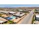 Spacious backyard featuring a pool and basketball court, set against a tranquil neighborhood backdrop, with a desert landscape at 7998 W Ford Ave, Las Vegas, NV 89113
