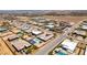 This overhead shot shows homesites featuring swimming pools and basketball courts, set against a desert landscape at 7998 W Ford Ave, Las Vegas, NV 89113