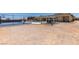 Spacious backyard with a basketball court and gazebo, creating an ideal outdoor space at 7998 W Ford Ave, Las Vegas, NV 89113