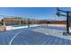 Home's basketball court overlooks pool and other outdoor features for easy entertainment at 7998 W Ford Ave, Las Vegas, NV 89113