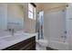 Bright bathroom features a shower-tub combo and modern vanity with white countertop at 7998 W Ford Ave, Las Vegas, NV 89113