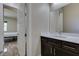 Bathroom doorway with a view of the vanity area and wood-style flooring at 7998 W Ford Ave, Las Vegas, NV 89113