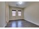 Bright bedroom features modern hardwood floors and neutral paint, enhancing the airy atmosphere at 7998 W Ford Ave, Las Vegas, NV 89113