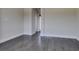 Spacious empty bedroom with wood floors, and white trim at 7998 W Ford Ave, Las Vegas, NV 89113