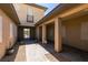 An open-air courtyard, featuring elegant pavers and potted plants, offers a serene and private outdoor retreat at 7998 W Ford Ave, Las Vegas, NV 89113