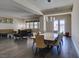 Bright dining room with an open floor plan to the living room and access to the backyard at 7998 W Ford Ave, Las Vegas, NV 89113
