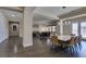 Open floor plan showcasing the dining room that features a marble table with seating for eight at 7998 W Ford Ave, Las Vegas, NV 89113