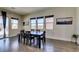 Dining room with hardwood floors and lots of natural light from the large windows at 7998 W Ford Ave, Las Vegas, NV 89113