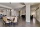The dining room has a modern light fixture above the table and access to the living room at 7998 W Ford Ave, Las Vegas, NV 89113