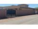 Secured by a gated wall, the property has desert landscaping and mailboxes along the quiet street at 7998 W Ford Ave, Las Vegas, NV 89113