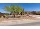 Charming two-story home with a three-car garage, desert landscaping, and a well-manicured front yard on a quiet street at 7998 W Ford Ave, Las Vegas, NV 89113