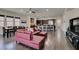 Spacious living room open to kitchen features hardwood floors and abundant natural light at 7998 W Ford Ave, Las Vegas, NV 89113