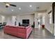 Bright open-concept living room boasts hardwood floors, a ceiling fan, and lots of natural light at 7998 W Ford Ave, Las Vegas, NV 89113