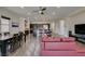 Bright and spacious living room features hardwood floors and a dining table with seating for six at 7998 W Ford Ave, Las Vegas, NV 89113