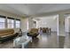 Open-concept living room with large windows and dining area at 7998 W Ford Ave, Las Vegas, NV 89113