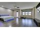 Spacious main bedroom with hardwood floors, recessed lights and a ceiling fan at 7998 W Ford Ave, Las Vegas, NV 89113