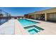 A beautiful in-ground pool and hot tub with an adjacent sport court are perfect for relaxing and entertaining at 7998 W Ford Ave, Las Vegas, NV 89113