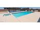 A dazzling in-ground pool and spa provide an oasis, with sport court in the background, for outdoor enjoyment at 7998 W Ford Ave, Las Vegas, NV 89113