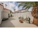 Cozy backyard featuring a seating area under palm trees at 8104 Bay Harbor Dr, Las Vegas, NV 89128
