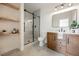 Well-lit bathroom with stylish vanity, marble countertop, and glass enclosed shower at 8104 Bay Harbor Dr, Las Vegas, NV 89128