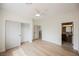 Sunlit bedroom boasts wood floors, closet, ensuite bath, and ceiling fan at 8104 Bay Harbor Dr, Las Vegas, NV 89128