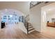 Spacious living room with high ceilings, modern staircase, and lots of natural light at 8104 Bay Harbor Dr, Las Vegas, NV 89128