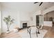 Cozy sitting area with a fireplace, modern decor, and an adjacent wine cellar at 8104 Bay Harbor Dr, Las Vegas, NV 89128
